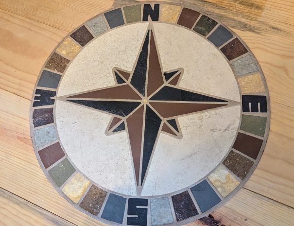 LOFT:: Enjoy the loft's blue pine floor and tile compass mosaic, as well as a distant mountain view.