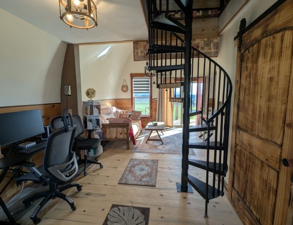 WORKSPACE: You have a work space, a spiral staircase to the twin bed and the XXL camping cot in the loft, a day bed and dining room table.
