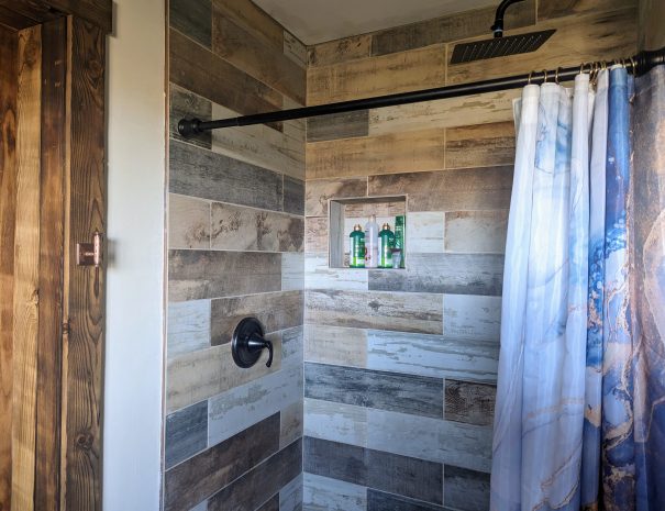 FULL BATHROOM: You'll find body wash, shampoo and conditioner in the wall niche in the walk-in  tiled shower.