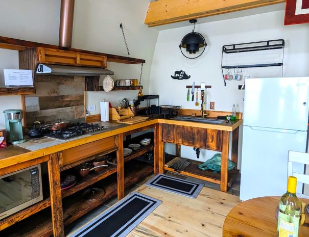 FULL KITCHEN: Includes fridge, freezer, utensils, pots, pans, cutlery.