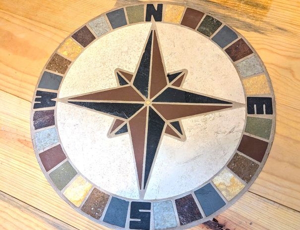 LOFT:: Enjoy the loft's blue pine floor and tile compass mosaic, as well as a distant mountain view.