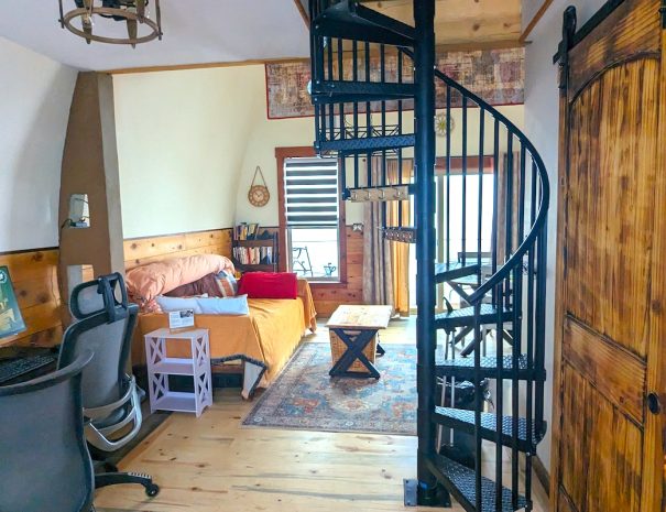WORKSPACE: You have a work space, a spiral staircase to the twin bed and the XXL camping cot in the loft, a day bed and dining room table.